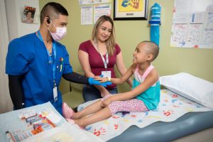 Cancer patient at Cure 4 The Kids Foundation receiving treatment